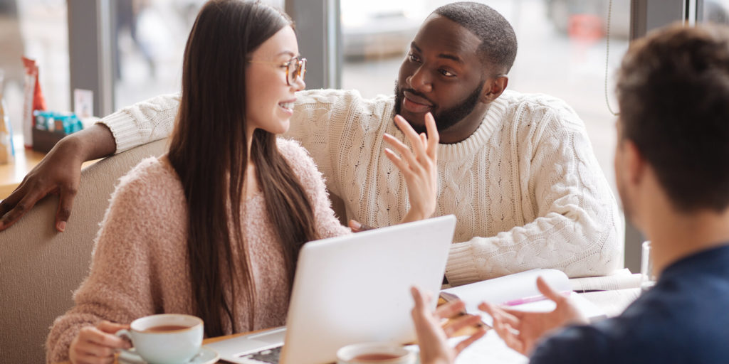 Three people collaborating